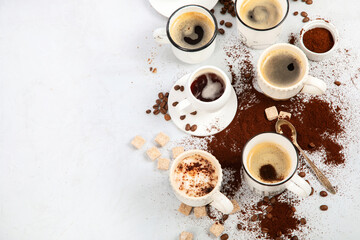 Coffee cup assortment on light background.