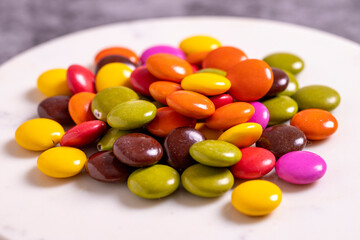 Colorful candies or bonbon. Chocolate filled candy on a dark background. close up