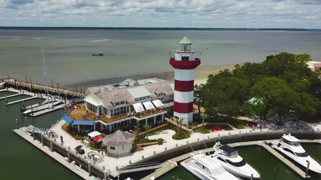 A wide orbiting shot of the lighthouse at Harbor Town on Hilton Head Island, SC