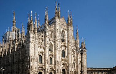 Fototapeta na wymiar Wide angle view of the amazing architecture landmark Milan Cathedral (Italian Duomo di Milano) in a beautiful sunny day with blue sky. Travel to Italy.