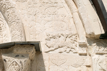 White stone carving on the walls of St. George's Cathedral. Yuryevsky Kremlin...