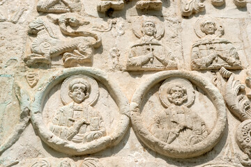 White stone carving on the walls of St. George's Cathedral. Yuryevsky Kremlin (Archangel-Mikhailovsky Yuryevsky monastery). Yuryev-Polsky town, Vladimir region, Russia
