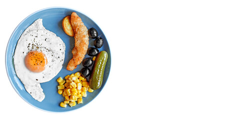 Beautiful breakfast in a blue plate on a white background. Fried eggs with spices and cheese. Beautiful breakfast service. Chicken nuggets, olives, pickles on a plate. Fish sticks in batter.