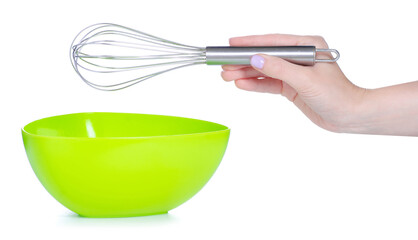 Plastic bowl with whisk in hand on white background isolation
