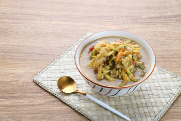 Rujak Serut, Indonesian fruit salad made from grated variety of fresh fruits and mixed with a sauce made of brown sugar, chili, salt and peanuts.

