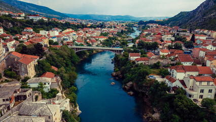 Fototapeta na wymiar Aerial View to the Old Bridge in the heart of the Old City of Mostar, Bosnia and Herzegovina