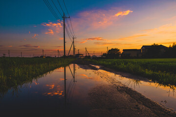 Fototapeta na wymiar 美しい夕焼け空と水たまり