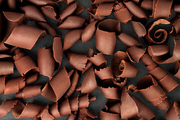 Scattered Chocolate Curls on black background