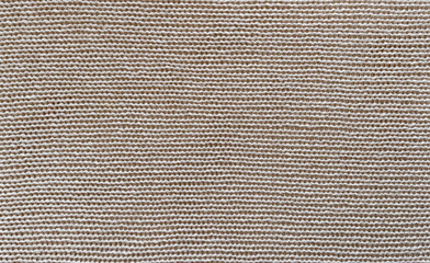 Texture of classic knitted fabric. The pattern is clearly visible.