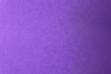 Rough violet or purple color paint on recycled cardboard box paper texture background 