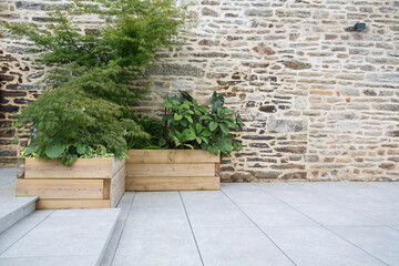 Modern garden design and terrace construction: Hillside plot paved with natural sidewalk flagstones...