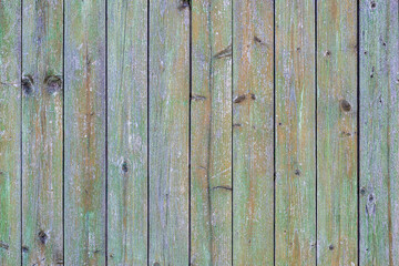 Wall of vertically folded planks with paint residues