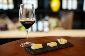 Glass of red wine and cheese.