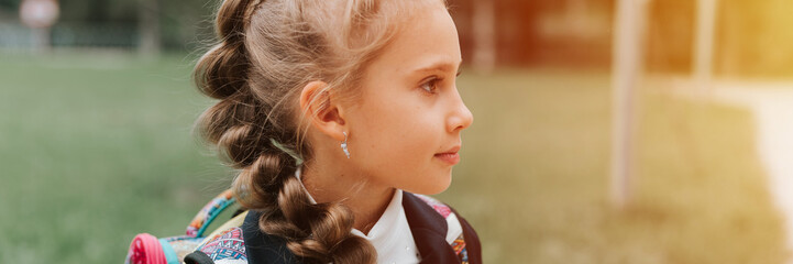 back to school. face portrait little happy kid pupil schoolgirl eight year old in fashion uniform...