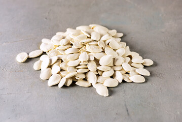 Dry Pumpkin Seeds on Gray Background Healthy Food Horizontal