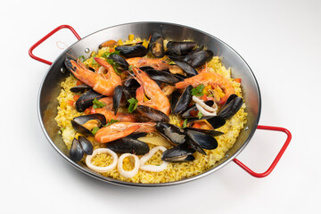 Schezwan Prawns in black bowl at dark slate background. Schezwan Prawns is indo-chinese cuisine curry dish with prawns or shrimps roasted in Schezwan Sauce.