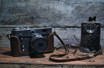 old camera on a wooden background