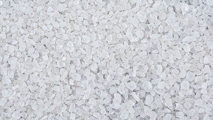 Top view of sea salt crystals as background. White marine rock salt.