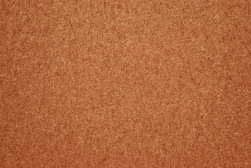 A sheet of brown cardboard surface texture as background
