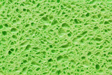 Green porous cleaning sponge texture or background