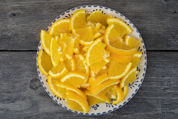 Fresh organic orange slices on surface