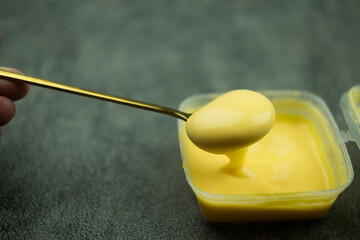 Cheese sauce on spoon