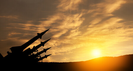 The missiles are aimed at the sky at sunset. Nuclear bomb, chemical weapons, missile defense, a...