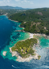 Fototapeta na wymiar Aerial view of Limni Beach Glyko, on the island of Corfu. Greece. Where the two beaches are connected to the mainland providing a wonderful scenery. Unique double beach. Kerkyra