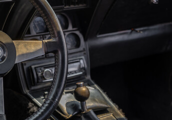 Obraz premium Vintage classic car interior. Steering wheel and dashboard