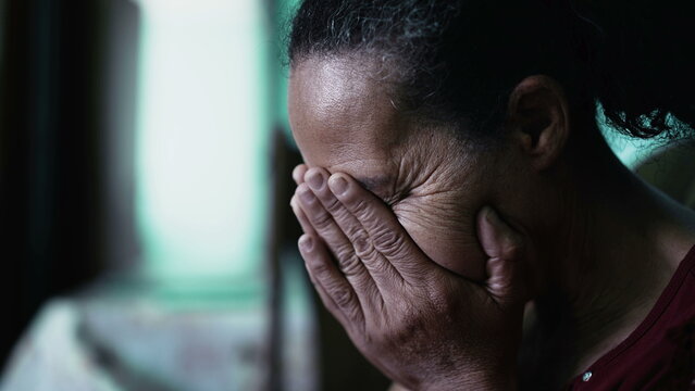 One Sad Depressed Senior Woman Covering Face With Hands Feeling Regret And Anxiety