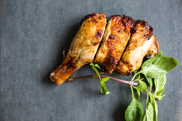 Chicken steak grilled on black plate