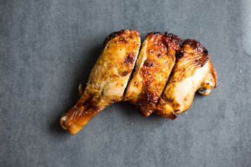 Chicken steak grilled on black plate