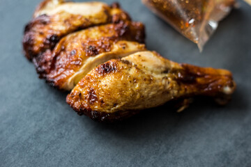 Chicken steak grilled on black plate