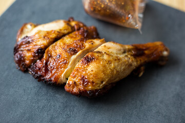 Chicken steak grilled on black plate