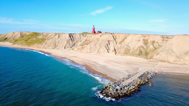 view from the sea to the famous Bovbjerg Fyr lighthouse in Jutland, Denmark, high quality image, aerial view