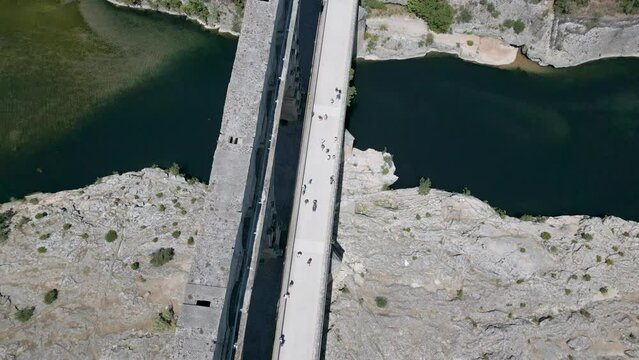 Top-down aerial view of The Pont du Gard, an ancient Roman aqueduct in France