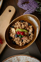 Top view of dry breakfast with fresh berries,orange juice on background.Healthy meal,vertical photography.