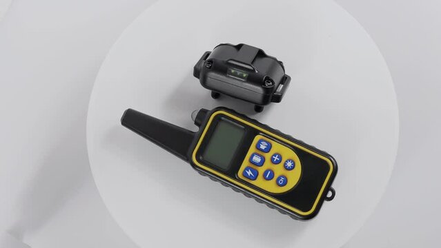 Collar and remote control for dog barking. Distance training collar to reduce or stop barking from external shock.