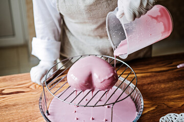 Mousse Cake. Mirror Glaze Cake. Process of making heart shape mousse cake with pink mirror glaze