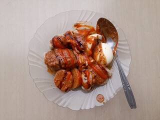 dumplings with peanut sauce on a plate against a wooden table background. dimsum food background concept, culinary, breakfast, lunch, dinner, food recipe, cuisine, meal, dish, restaurant, cooking