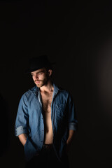  Portrait of a man in a dark key in the studio