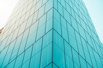 Obraz premium underside panoramic and perspective view to steel blue glass high rise building skyscrapers