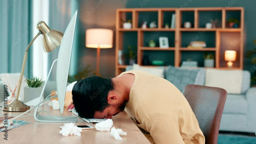Poster Man feeling sick and tired while working on his computer and working from home. Overworked freelance entrepreneur falling asleep and passing out at his desk while suffering from a cold or flu virus