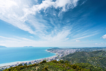 Fototapeta na wymiar Attractive spring cityscape of Vlore city from Kanines fortress. Captivating morning sescape of Adriatic sea. Spectacular outdoor scene of Albania, Europe. Traveling concept background.