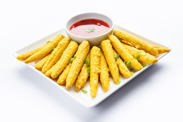 Crispy fried baby corn pakoda, pakora  or Baby corn fritters served with ketchup, Indian food