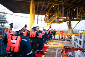 Offshore queuing workers work on decks during disembarkation operations to rest on the rig. - obrazy, fototapety, plakaty