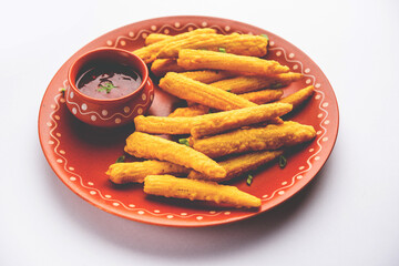 Crispy fried baby corn pakoda, pakora  or Baby corn fritters served with ketchup, Indian food