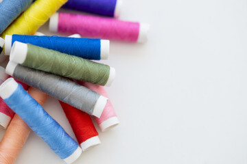 Fototapeta na wymiar Sewing threads on white