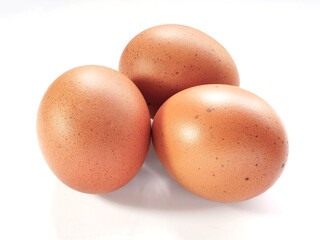 Three Eggs of brown chicken on white background. Easter concept or cooking fresh foods