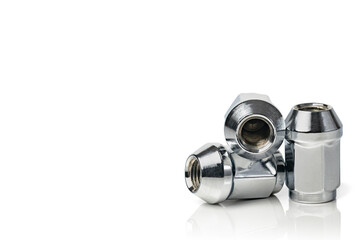 Wheel nuts isolated on white background. Car spare part. Metal nut fastening the car wheel. Copy...